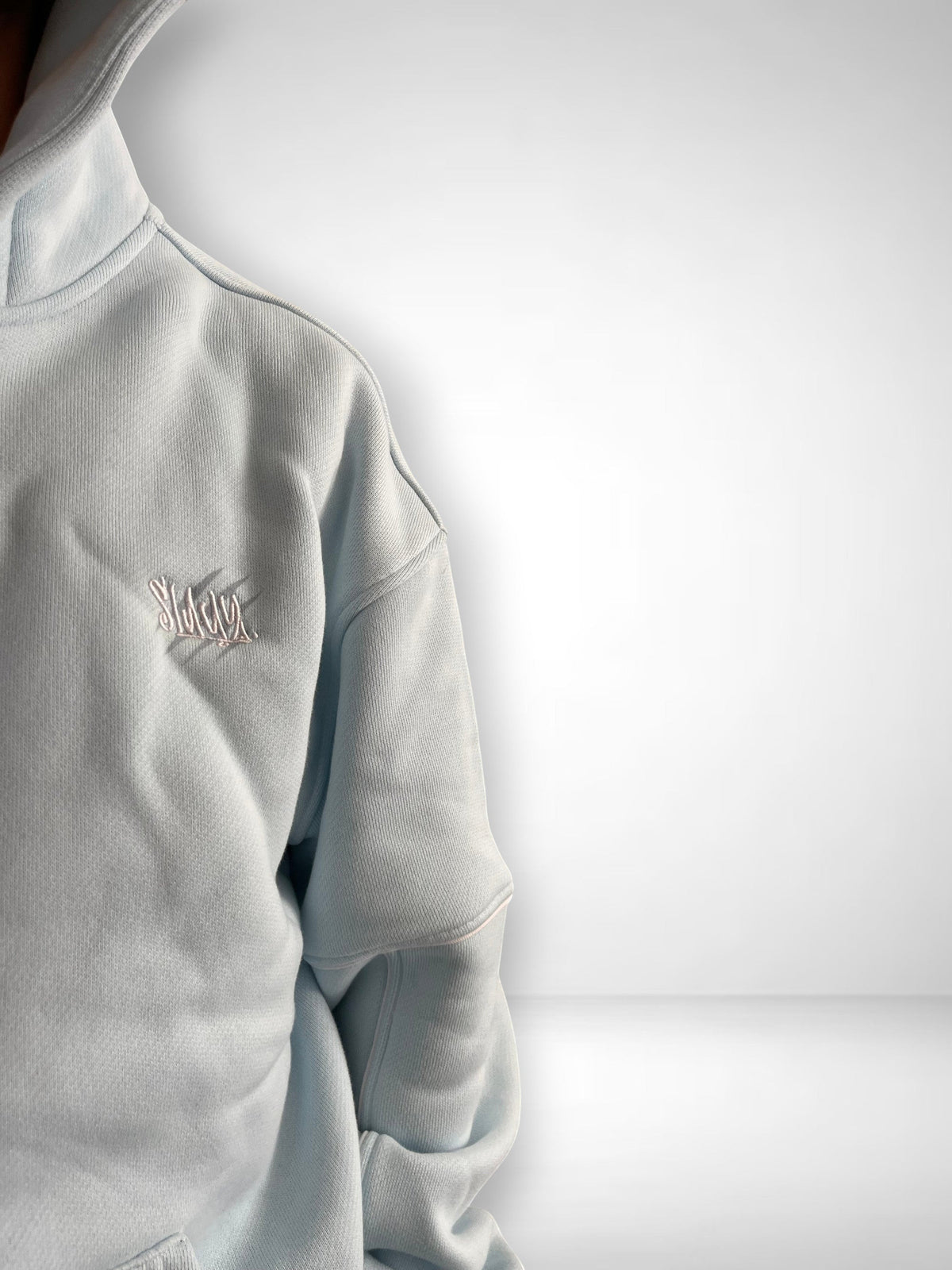 SLAYZ light blue cotton blend hoodie with embroidered logo on chest, full zip, hood, and pockets.